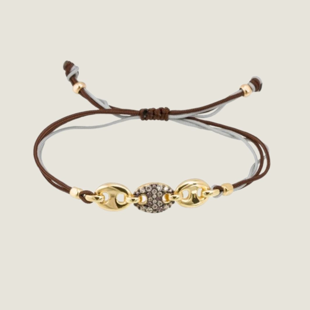 Pulsera Marina García de calabrote en plata dorada y circonitas con macramé